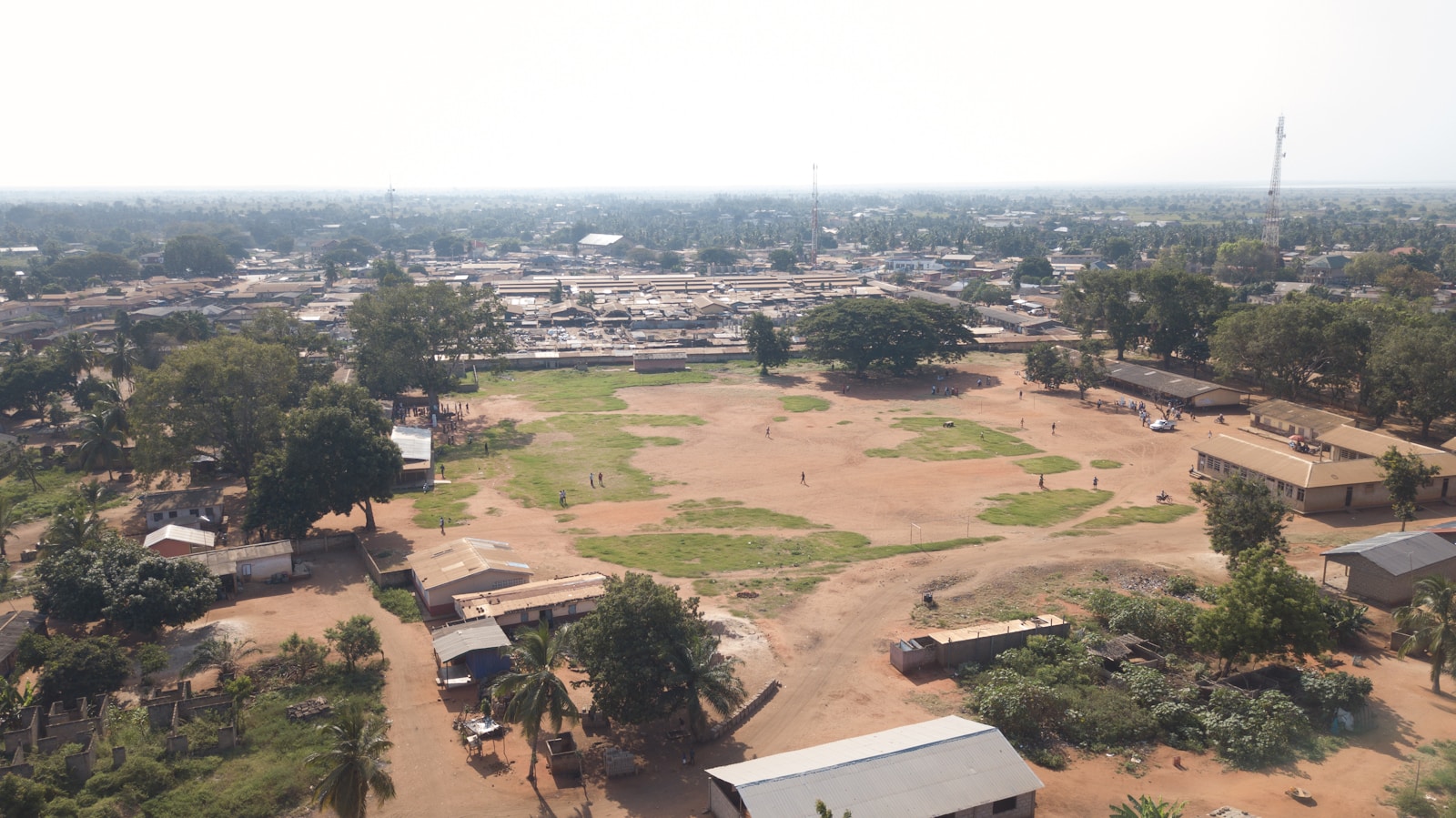 Aerial view of a Ghanaian town and surrounding greenery